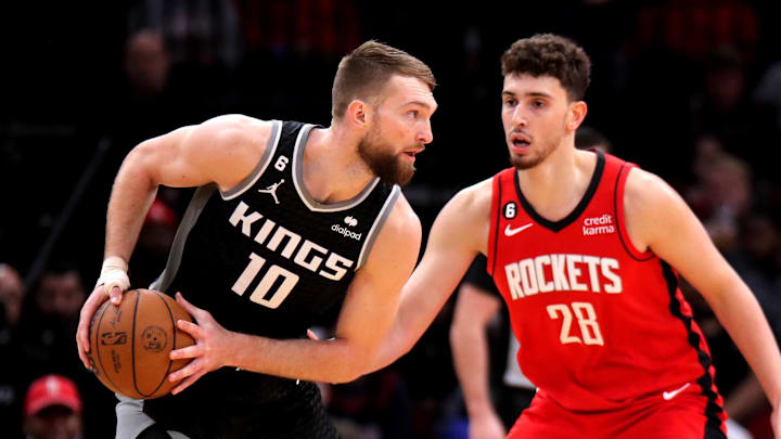 Feb 8, 2023; Houston, Texas, USA; Sacramento Kings forward Domantas Sabonis (10) handles the ball against Houston Rockets center Alperen Sengun (28) during the first quarter at Toyota Center.