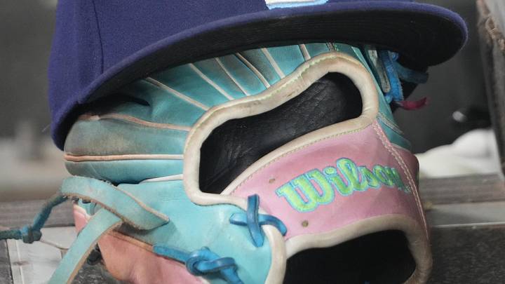 Sep 26, 2025; Toronto, Ontario, CAN; The hat and glove of Tampa Bay Rays third baseman Junior Caminero (13) in the dugout during the game against the Toronto Blue Jays at Rogers Centre. 
