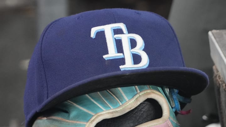 Sep 26, 2025; Toronto, Ontario, CAN; The hat and glove of Tampa Bay Rays third baseman Junior Caminero (13) in the dugout during the game against the Toronto Blue Jays at Rogers Centre. 