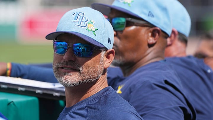 Feb 26, 2026; Fort Myers, Florida, USA; Tampa Bay Rays manager Kevin Cash looks on from the dugout during the fourth inning against the Boston Red Sox at JetBlue Park at Fenway South. 