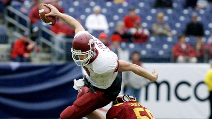 Arkansas quarterback Matt Jones tries to get around Minnesota linebacker Terrance Campbell in the first half. Minnesota defeated No. 25 Arkansas 29-14 before 39,183 in the Music City Bowl in Nashville Dec. 30, 2002.