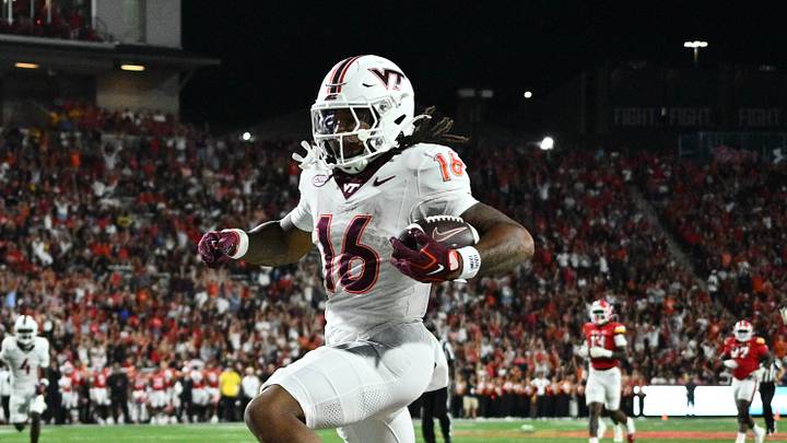 Sep 19, 2026; College Park, Md.; Virginia Tech running back Jeffrey Overton, Jr. (16) leaps out of the grasp of Maryland defensive back Lavain Scruggs (2). Sep 19, 2026; College Park, Md.; Virginia Tech running back Jeffrey Overton, Jr. (16) leaps out of the grasp of Maryland defensive back Lavain Scruggs (2).