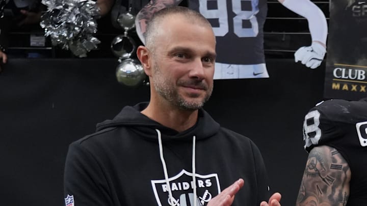 Dec 7, 2025; Paradise, Nevada, USA;  Las Vegas Raiders defensive end Maxx Crosby (98) along with his wife Rachel Washburn and daughter Ella Rose Crosby and Raiders general manager John Spytek receives the Walter Payton Man of the Year Award prior to a game against the Denver Broncos at Allegiant Stadium. Mandatory Credit: Kirby Lee-Imagn Images