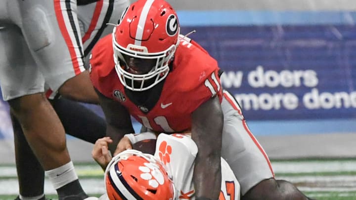 Aug 31, 2024; Atlanta, Georgia, USA; Georgia Bulldogs linebacker Jalon Walker (11) sacks Clemson Tigers quarterback Cade Klubnik (2) during the fourth quarter of the 2024 Aflac Kickoff Game at Mercedes-Benz Stadium. Mandatory Credit: Ken Ruinard-Imagn Images