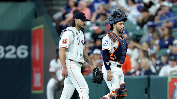 May 6, 2026; Houston, Texas, USA; Houston Astros pitcher Lance McCullers Jr. (43) and catcher Cesar Salazar (18) walk to the dugout after warming up prior to the game against the Los Angeles Dodgers at Daikin Park. Mandatory Credit: Erik Williams-Imagn Images

