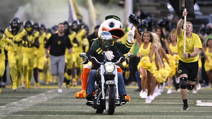 Oct 4, 2024; Eugene, Oregon, USA; The Oregon Ducks mascot rides out to the field on a motorcycle as the football team takes the field before a game against the Michigan State Spartans at Autzen Stadium. Mandatory Credit: Troy Wayrynen-Imagn Images