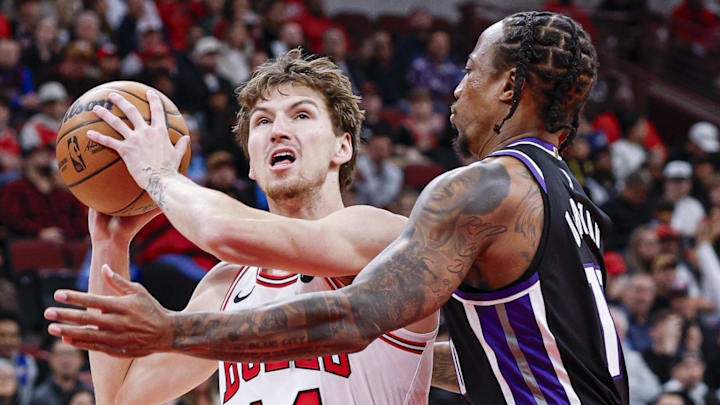 Oct 29, 2025; Chicago, Illinois, USA; Chicago Bulls forward Matas Buzelis (14) drives to the basket against Sacramento Kings guard DeMar DeRozan (10) during the first half at United Center. Mandatory Credit: Kamil Krzaczynski-Imagn Images