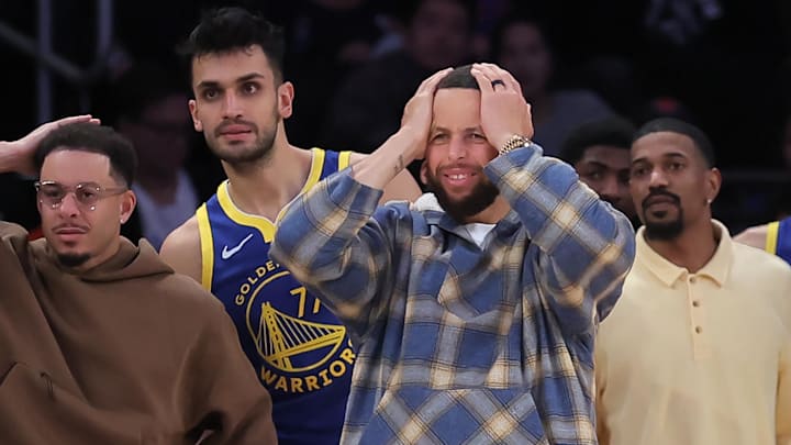 Mar 15, 2026; New York, New York, USA; Golden State Warriors guards Seth Curry (31) and Stephen Curry (30) react from the bench during the fourth quarter against the New York Knicks at Madison Square Garden. Mandatory Credit: Brad Penner-Imagn Images