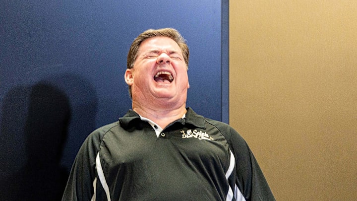 Jun 18, 2025; New Orleans, LA, USA;  Saints Hall of Fame general manager Ken Trahan laughs at a comment Former New Orleans Saints defensive back Brett Maxie made during the New Orleans Saints Hall of Fame press conference. Mandatory Credit: Stephen Lew-Imagn Images