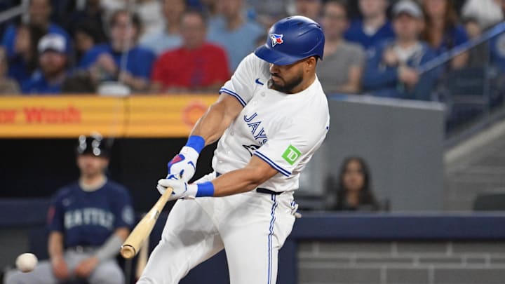 Apr 19, 2025; Toronto, Ontario, CAN;  Toronto Blue Jays right fielder Anthony Santander (25) hits an RBI single against the Seattle Mariners in the first inning at Rogers Centre. 