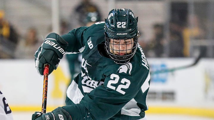Michigan State left wing Isaac Howard shoots the puck against Michigan defenseman Luca Fantilli during the first period at Yost Ice Arena in Ann Arbor on Friday, Feb. 9, 2024. Michigan State left wing Isaac Howard shoots the puck against Michigan defenseman Luca Fantilli during the first period at Yost Ice Arena in Ann Arbor on Friday, Feb. 9, 2024.