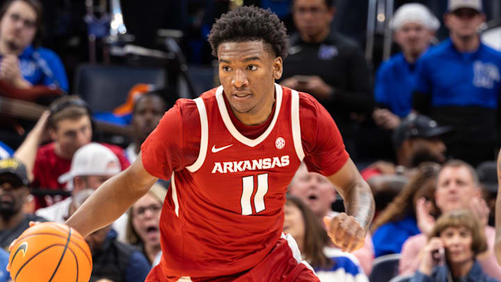 Arkansas Razorbacks guard Karter Knox (11) dribbles the ball up the court against the Memphis Tigers during the second half at FedEx Forum. Arkansas Razorbacks guard Karter Knox (11) dribbles the ball up the court against the Memphis Tigers during the second half at FedEx Forum.