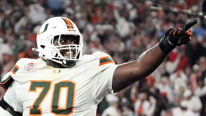 Miami (FL) Hurricanes offensive lineman Markel Bell (70) celebrates after going up 31-27 against the Mississippi Rebels late in the fourth quarter during the Vrbo Fiesta Bowl and CFP semifinal game at State Farm Stadium on Jan. 8, 2026, in Glendale.