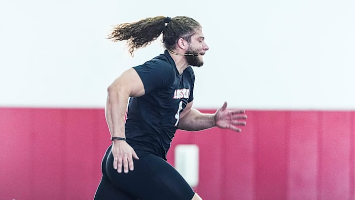 Louisville defensive end Ashton Gillotte runs a 40 yard dash during Pro Day..