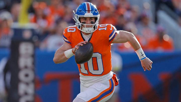 Jan 4, 2026; Denver, Colorado, USA; Denver Broncos quarterback Bo Nix (10) runs with the ball against the Los Angeles Chargers during the first half at Empower Field at Mile High. Jan 4, 2026; Denver, Colorado, USA; Denver Broncos quarterback Bo Nix (10) runs with the ball against the Los Angeles Chargers during the first half at Empower Field at Mile High.