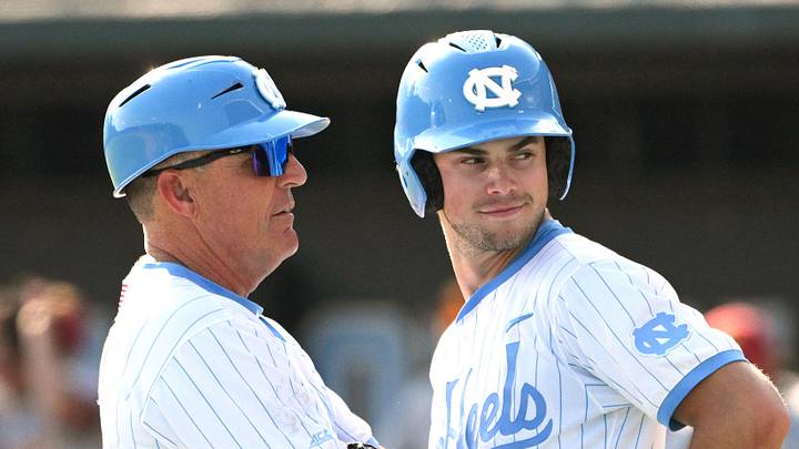 June 7, 2026; Chapel Hill, NC, USA; North Carolina Tar Heels head coach Scott Forbes coaches outfielder Carter French (18) during the ninth inning against the USC Trojans at Boshamer Stadium. Mandatory Credit: Zachary Taft-Imagn Images June 7, 2026; Chapel Hill, NC, USA; North Carolina Tar Heels head coach Scott Forbes coaches outfielder Carter French (18) during the ninth inning against the USC Trojans at Boshamer Stadium. Mandatory Credit: Zachary Taft-Imagn Images