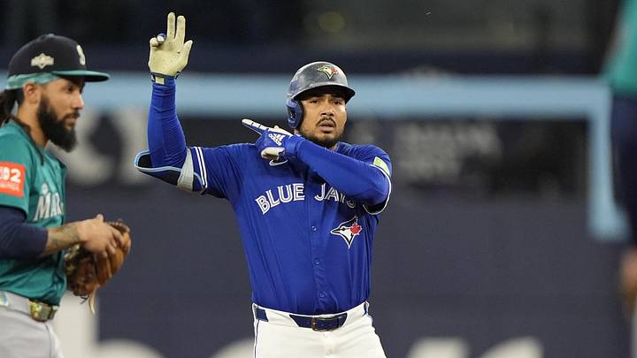 Oct 12, 2025; Toronto, Ontario, CAN; Toronto Blue Jays right fielder Anthony Santander (25) celebrates at second base in the second inning against the Seattle Mariners during game one of the ALCS round for the 2025 MLB playoffs at Rogers Centre. Mandatory Credit: John E. Sokolowski-Imagn Images