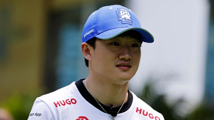 May 2, 2024; Miami Gardens, Florida, USA; RB racing driver Yuki Tsunoda (22) walks into the team village in advance of the F1 Miami Grand Prix at the Miami International Autodrome. Mandatory Credit: Peter Casey-USA TODAY Sports