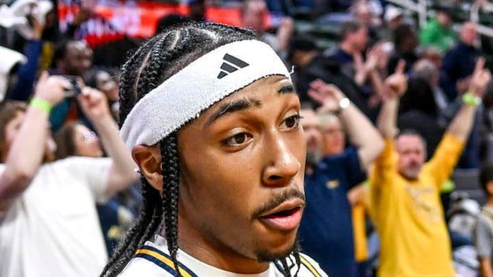Wayne Memorial's Carlos Medlock Jr., left, shakes hands with Jalahn McClellan after beating Flint Carman-Ainsworth in the Division 1 state semifinal on Friday, March 14, 2025, at the Breslin Center in East Lansing.