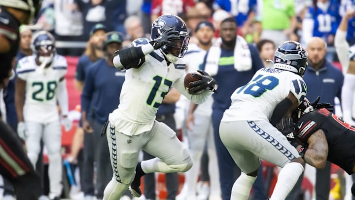 Dec 8, 2024; Glendale, Arizona, USA; Seattle Seahawks linebacker Ernest Jones IV (13) returns an interception against the Arizona Cardinals in the first half at State Farm Stadium. Mandatory Credit: Mark J. Rebilas-Imagn Images