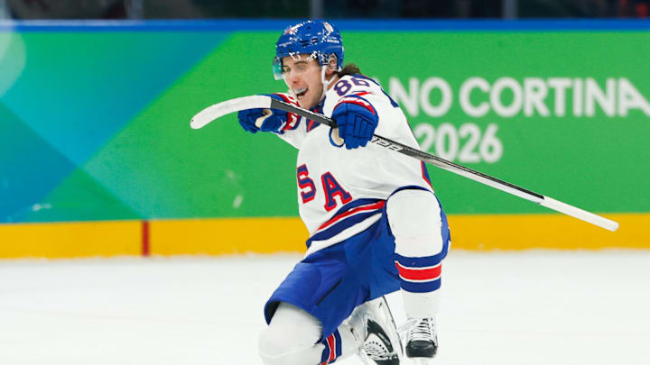 Feb 20, 2026; Milan, Italy; Jack Hughes (86) of the United States celebrates after scoring a goal during the second period against Slovakia in a men's ice hockey semifinal during the Milano Cortina 2026 Olympic Winter Games at Milano Santagiulia Ice Hockey Arena. Mandatory Credit: Geoff Burke-Imagn Images