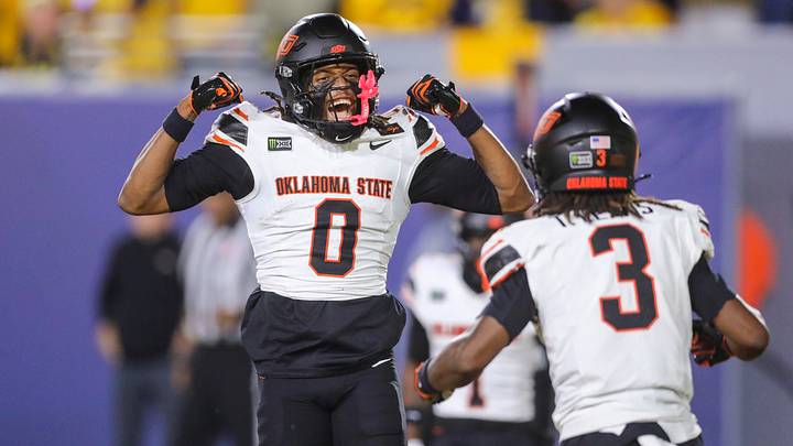 Sep 26, 2026; Morgantown, West Virginia, USA;  Oklahoma State Cowboys wide receiver Justin Bowick (0) celebrates with Oklahoma State Cowboys wide receiver Terrence Lewis (3) after a score during the third quarter against the West Virginia Mountaineers at Milan Puskar Stadium.  Mandatory Credit: Ben Queen-Imagn Images