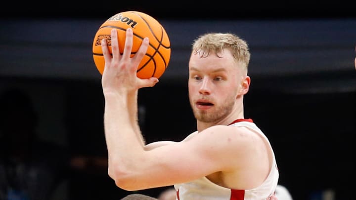 Nebraska Cornhuskers forward Rienk Mast (51) handles the ball as Texas A&M Aggies guard Hayden Hefner (2) defends during the 2024 NCAA Tournament First Round at FedExForum.