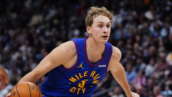 Jan 18, 2026; Denver, Colorado, USA; Denver Nuggets forward Hunter Tyson (5) dribbles in the second half against the Charlotte Hornets at Ball Arena. Mandatory Credit: Ron Chenoy-Imagn Images