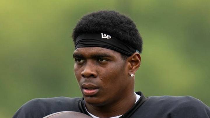 Indianapolis Colts cornerback Cam Taylor-Britt tosses a ball