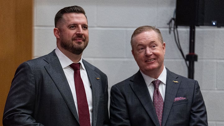 Florida State University’s new men’s basketball coach Luke Loucks stands with FSU Athletic Director Michael Alford before a press conference Monday, March 10, 2025.