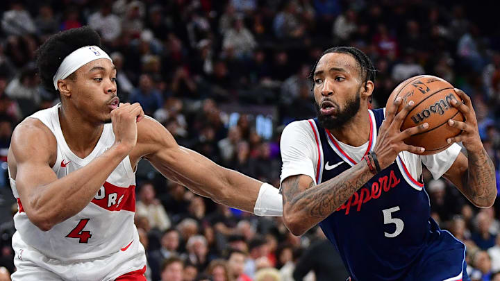 Los Angeles Clippers forward Derrick Jones Jr. moves to the basket against Toronto Raptors forward Scottie Barnes.