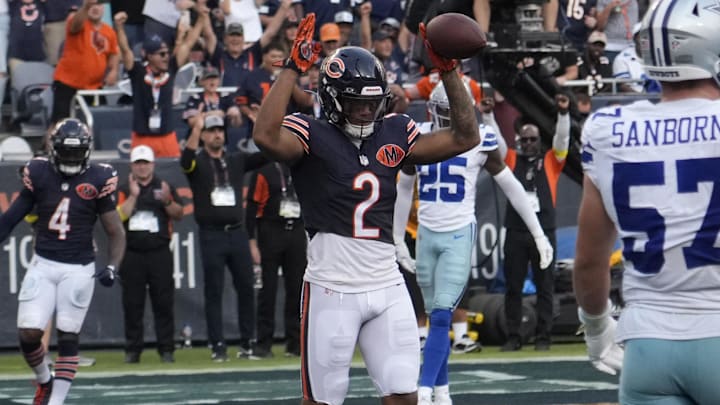 Sep 21, 2025; Chicago, Illinois, USA; Chicago Bears wide receiver DJ Moore (2) celebrates his touchdown against the Dallas Cowboys during the second half at Soldier Field.
