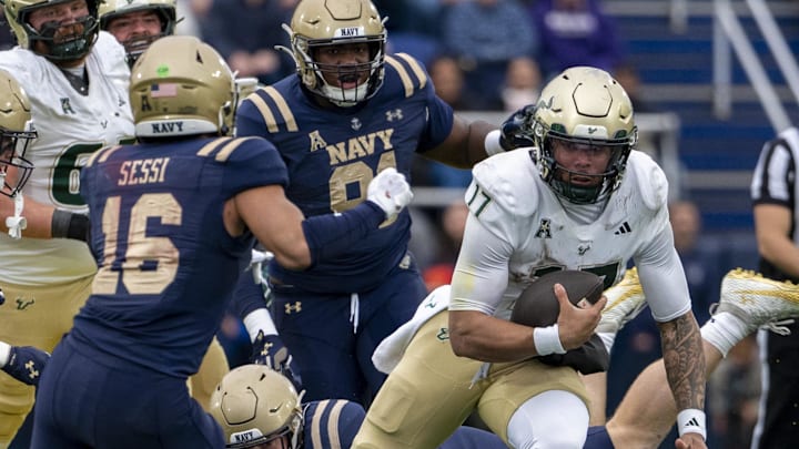 Nov 15, 2025; Annapolis, Maryland, USA; South Florida Bulls quarterback Byrum Brown (17) scrambles through the Navy Midshipmen defense during the second half at Navy-Marine Corps Memorial Stadium. Navy Midshipmen defeated South Florida Bulls 41-28. Mandatory Credit: Tommy Gilligan-Imagn Images Nov 15, 2025; Annapolis, Maryland, USA; South Florida Bulls quarterback Byrum Brown (17) scrambles through the Navy Midshipmen defense during the second half at Navy-Marine Corps Memorial Stadium. Navy Midshipmen defeated South Florida Bulls 41-28. Mandatory Credit: Tommy Gilligan-Imagn Images