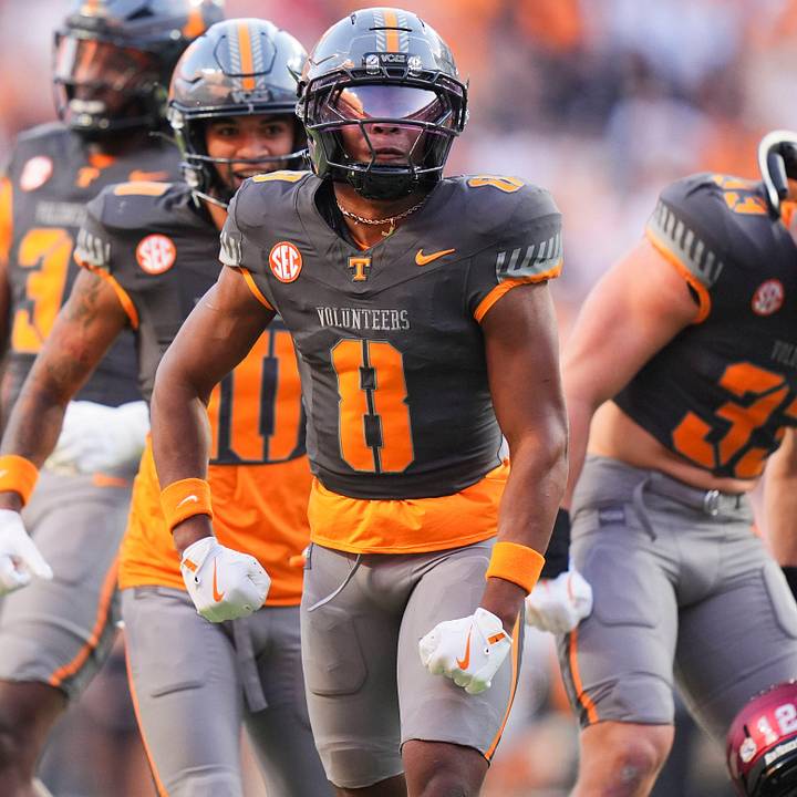 Tennessee defensive back Colton Hood and the Tennessee defense celebrate after a play, stopping the New Mexico State offense.