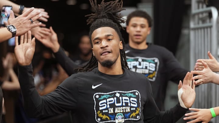 Feb 19, 2026; Austin, Texas, USA; San Antonio Spurs guard Stephon Castle (5) greets fans while entering the court before a game against the Phoenix Suns at Moody Center. Mandatory Credit: Scott Wachter-Imagn Images
