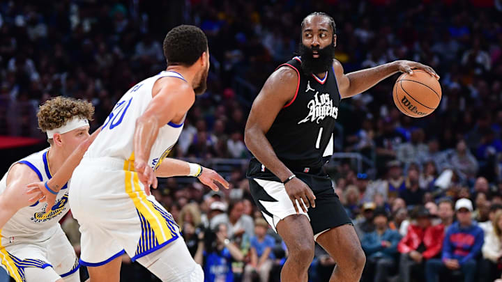 Los Angeles Clippers guard James Harden (1) against Golden State Warriors guard Stephen Curry (30) at Crypto.com Arena. 