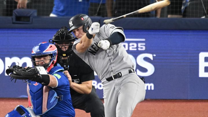 Oct 4, 2025; Toronto, Ontario, CAN; New York Yankees shortstop Anthony Volpe (11) loses his bat in the ninth inning against the Toronto Blue Jays during game one of the ALDS round for the 2025 MLB playoffs at Rogers Centre. Mandatory Credit: Dan Hamilton-Imagn Images