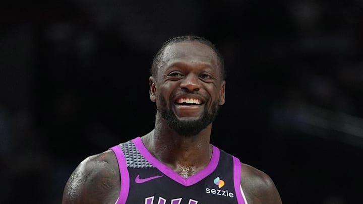 Feb 24, 2026; Portland, Oregon, USA; Minnesota Timberwolves forward Julius Randle (30) and Portland Trail Blazers guard Jrue Holiday (5) share a laugh during the second half at Moda Center. Mandatory Credit: Soobum Im-Imagn Images