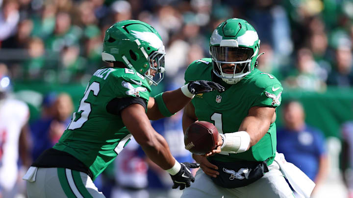 Philadelphia Eagles quarterback Jalen Hurts and running back Saquon Barkley wore basketball-inspired football cleats. Philadelphia Eagles quarterback Jalen Hurts and running back Saquon Barkley wore basketball-inspired football cleats.
