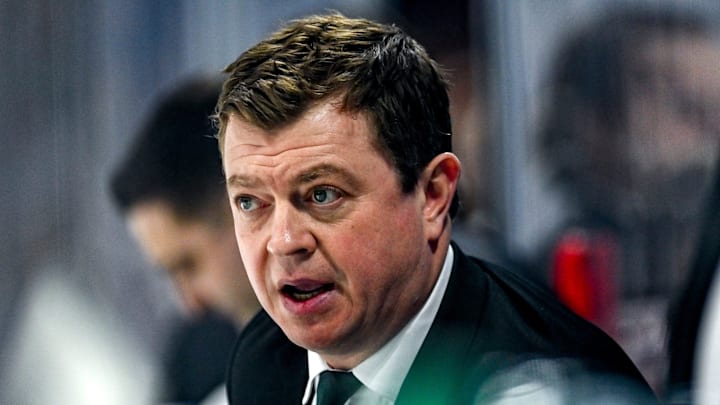 Michigan State's head coach Adam Nightingale talks with players on the bench during the second period in the game against Michigan on Friday, Jan. 19, 2024, at Munn Arena in East Lansing.