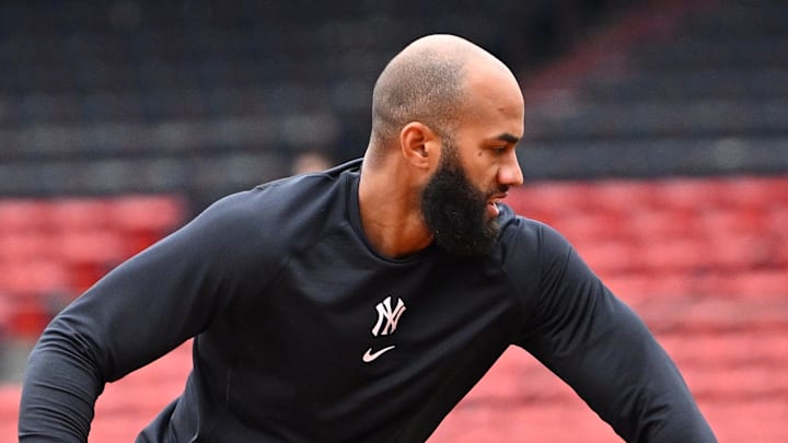 New York Yankees third baseman Amed Rosario (14) warms up before a game against the Boston Red Sox at Fenway Park.