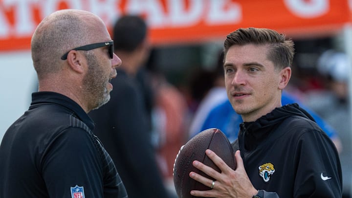 Jacksonville Jaguars General Manager James Gladstone, right, talks along the sideline after the Jaguars 14th NFL training camp session at Miller Electric Center Tuesday August 12, 2025 in Jacksonville, Fla. The Jaguars travel to New Orleans to play the Saints this Sunday in their second preseason game. [Doug Engle/Florida Times-Union]