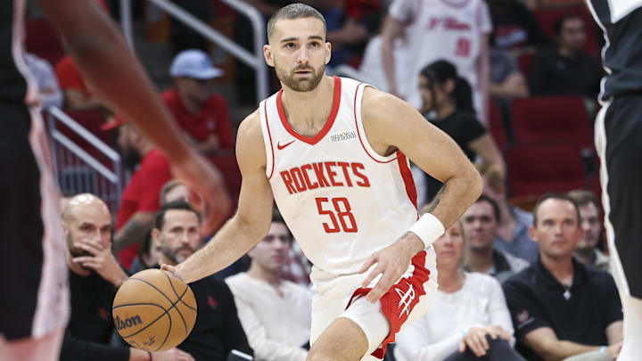 Former Houston Rockets guard Jack McVeigh (58) dribbles the ball.