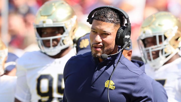 Sep 27, 2025; Fayetteville, Arkansas, USA; Notre Dame Fighting Irish head coach Marcus Freeman during the first quarter against the Arkansas Razorbacks at Donald W. Reynolds Razorback Stadium. Sep 27, 2025; Fayetteville, Arkansas, USA; Notre Dame Fighting Irish head coach Marcus Freeman during the first quarter against the Arkansas Razorbacks at Donald W. Reynolds Razorback Stadium.