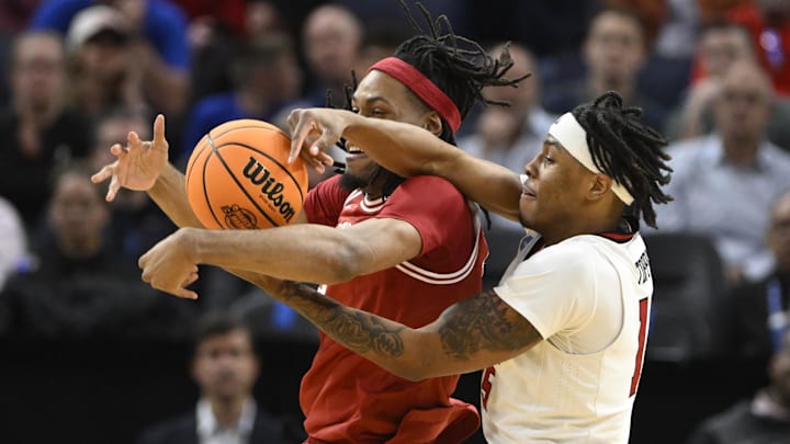 Texas Tech Red Raiders forward JT Toppin (15) and Arkansas Razorbacks forward Jonas Aidoo (9) battle for control of the ball during the first half during a West Regional semifinal of the 2025 NCAA tournament at Chase Center. Texas Tech Red Raiders forward JT Toppin (15) and Arkansas Razorbacks forward Jonas Aidoo (9) battle for control of the ball during the first half during a West Regional semifinal of the 2025 NCAA tournament at Chase Center.
