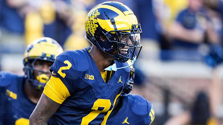 Michigan defensive back Will Johnson (2) celebrates a touchdown after intercepting USC quarterback Miller Moss (7) during the second half at Michigan Stadium in Ann Arbor on Saturday, Sept. 21, 2024. Michigan defensive back Will Johnson (2) celebrates a touchdown after intercepting USC quarterback Miller Moss (7) during the second half at Michigan Stadium in Ann Arbor on Saturday, Sept. 21, 2024.