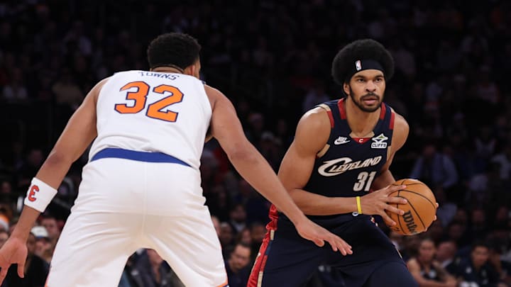 Dec 25, 2025; New York, New York, USA; Cleveland Cavaliers center Jarrett Allen (31) dribbles against New York Knicks center Karl-Anthony Towns (32) during the first half at Madison Square Garden. Mandatory Credit: Vincent Carchietta-Imagn Images