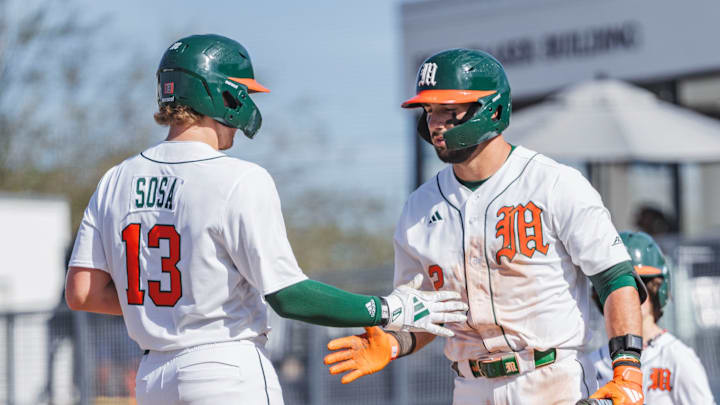 Miami Hurricanes catcher Alex Sosa (13) and right fielder Derek Williams (2) against Lafayette 