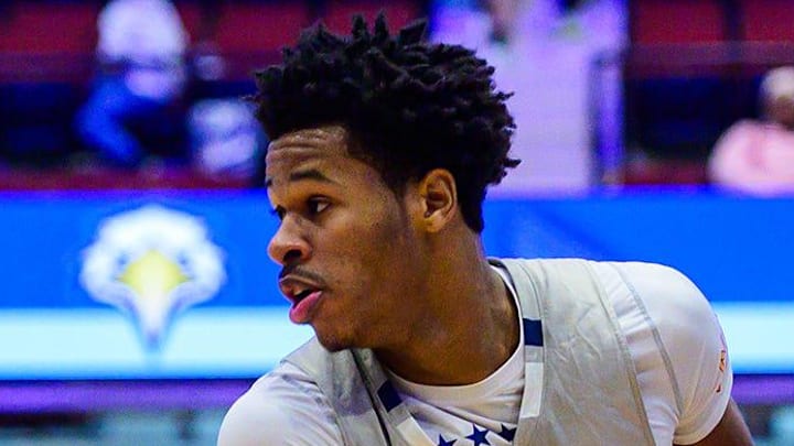 Stepinac's Jasiah Jervis, right, looks through a Thomas Jefferson defender during the William F. Plunkett Jr Christmas Classic at the Westchester County Center in White Plains, NY on Sunday, December 7, 2025. Stepinac defeated Thomas Jefferson 92-70.