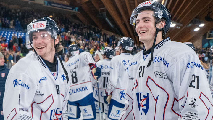 Joey Muldowney  (Connecticut) and Ryan Walsh (Cornell) of the U.S. Collegiate Selects are all smiles after upsetting tournament host Davos at the Spengler Cup, 5-3. 